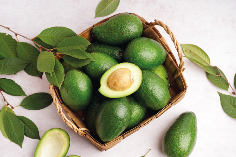 Avocados in a basket in Colombia, where are hass avocados grown.