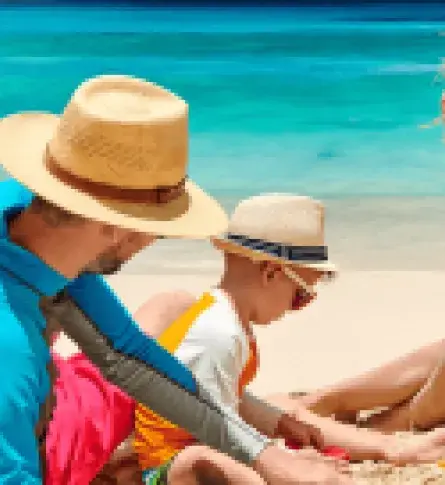 Two friends on their way to the beach. One is wearing a women one piece swimwear