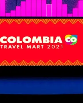 Escenario con pantalla de evento de Colombia CO  travel mart 2021