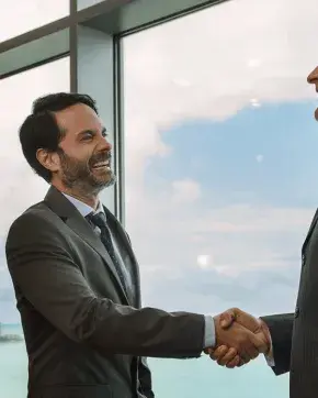 Two executives shaking hands