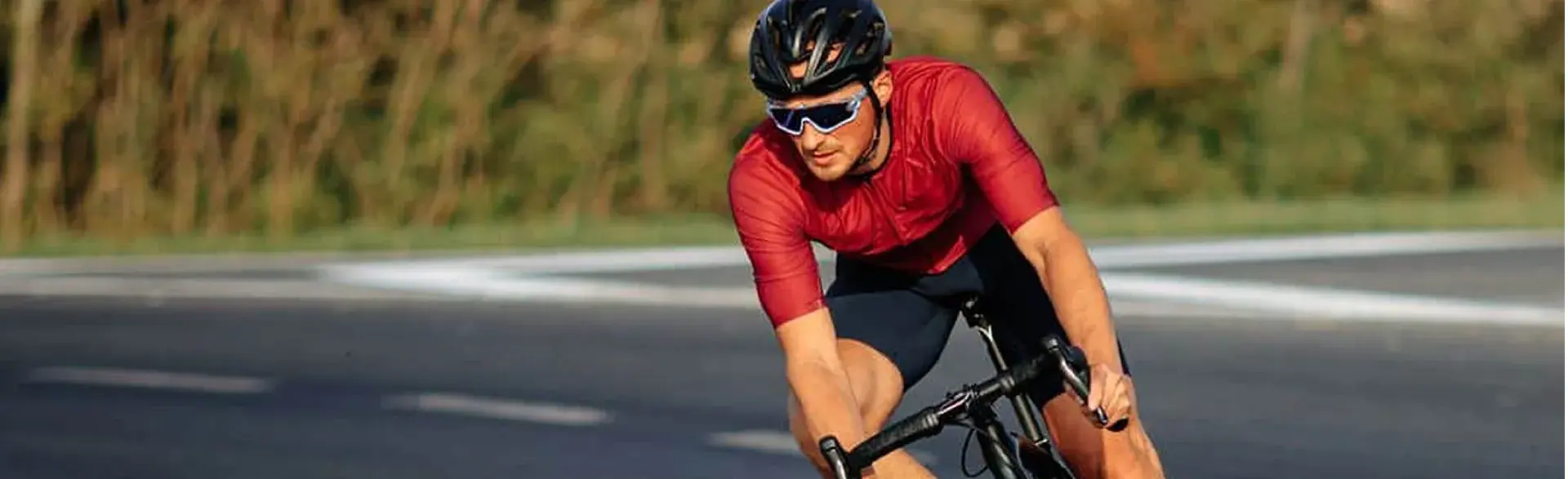 Cyclist wearing men's cycling clothing, one of the clombian road cycling helmets