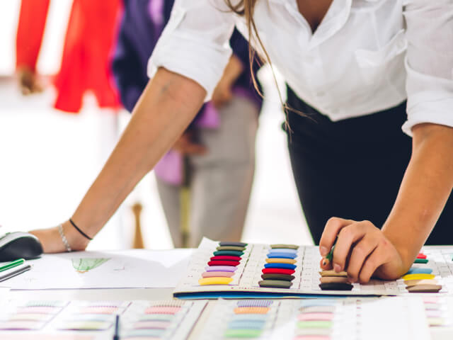 Fashion designer working in her atelier