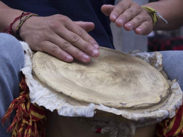 Colombian musician playing the drum.